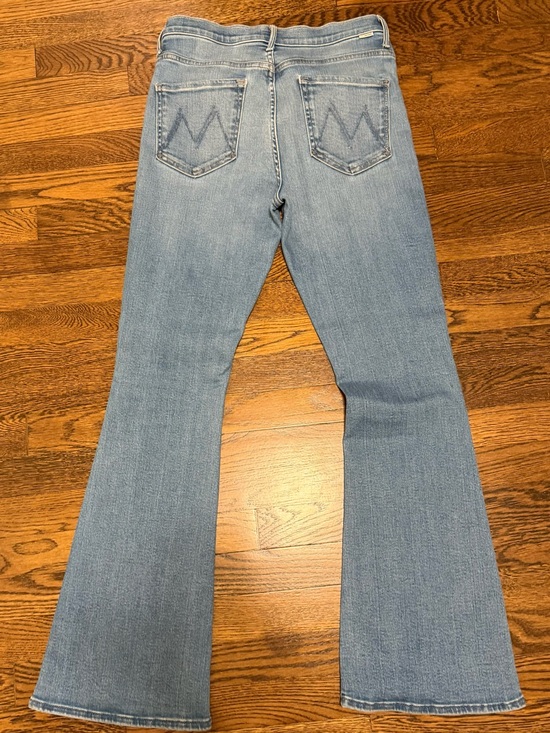 MOTHER Denim - MOTHER weekender mid-rise flare jeans in “ride hard live forever” wash.